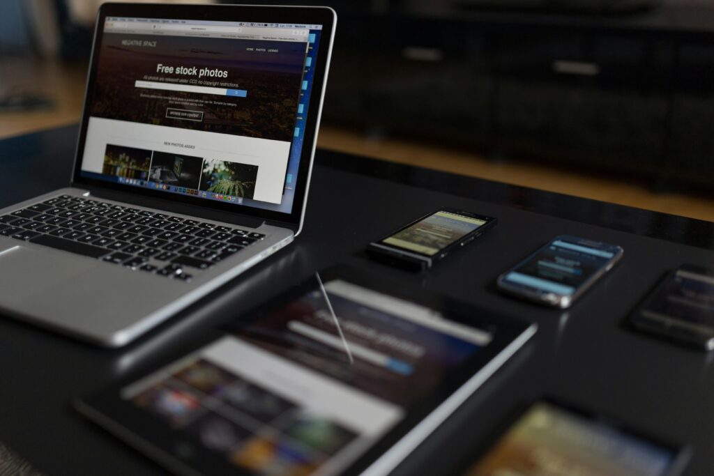 pexels-photo-34140 A contemporary workspace showcasing a laptop, tablet, and smartphones, ideal for tech and freelance use.